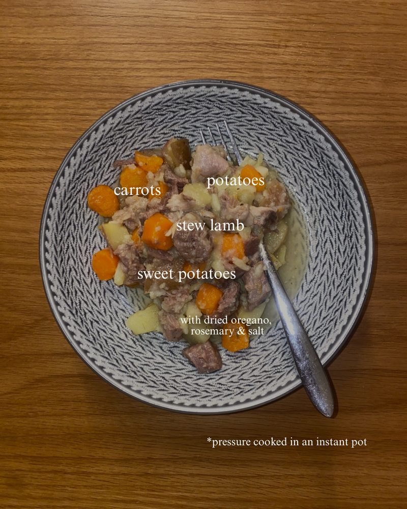 Lamb stew with potatoes, carrots and fresh herbs